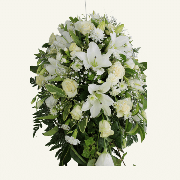 Casket Cover of Seasonal Flowers and foliage. Neutrals colours whites, creams, lemons, greens.