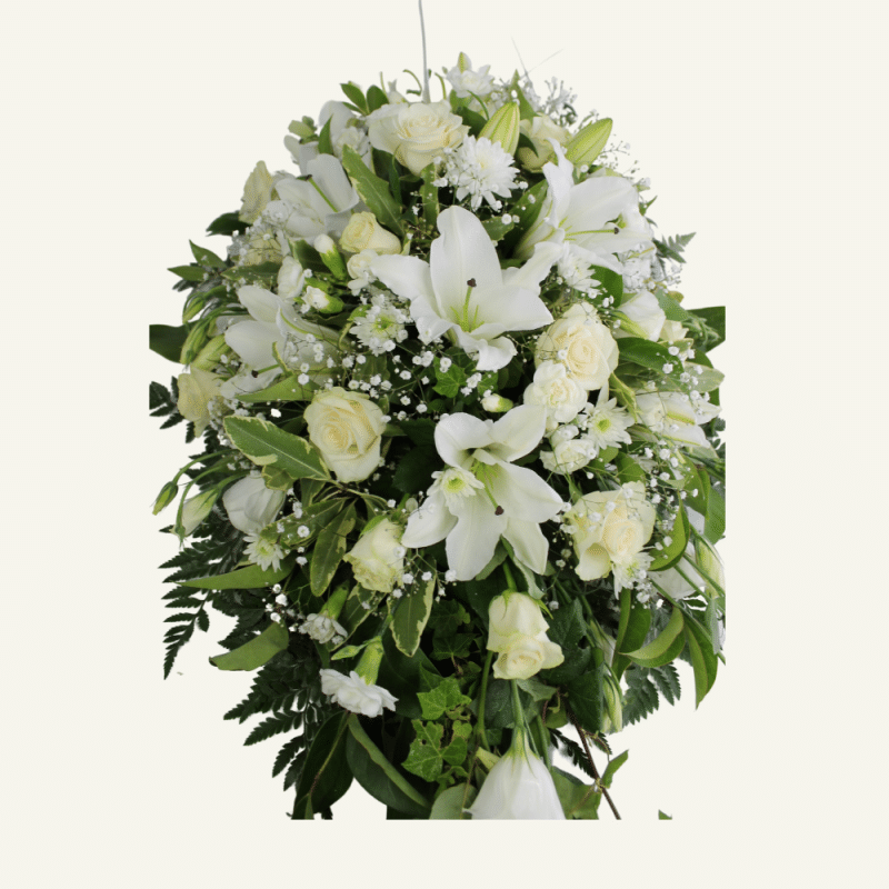 Casket Cover of Seasonal Flowers and foliage. Neutrals colours whites, creams, lemons, greens.