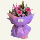 A fresh flower bouquet in shades of Lavenders, Mauves & pinks. Beautifully presented in matching coloured wrap & bow.