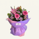 A fresh flower bouquet in shades of Lavenders, Mauves & pinks. Beautifully presented in matching coloured wrap & bow.