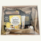 A giftbox, selection of NZ treats chutneys, fruit paste, sparkling ginger beer, crackers, NZ Donovan's chocolates, coffee sachets. All gift wrapped in a box with clear lid & matching bow. Kowhai yellow themed.