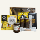 A giftbox, selection of NZ treats chutneys, fruit paste, sparkling ginger beer, crackers, NZ Donovan's chocolates, coffee sachets. All gift wrapped in a box with clear lid & matching bow. Kowhai yellow themed.