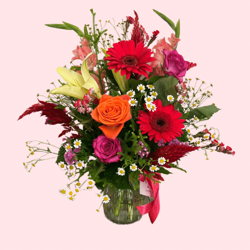 Love Bomb Vase arrangement with vibrant seasonal flowers in a glass vase by Amber-Lee Florist Whangārei