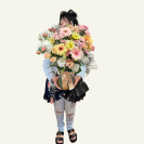“Deluxe Blossom Vase Whangarei bouquet with pastel flowers and foliage in reusable glass vase.”