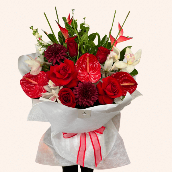 Strawberries & Cream bouquet with red roses, white orchids and tropical flowers by Amber Lee Florist Whangārei.