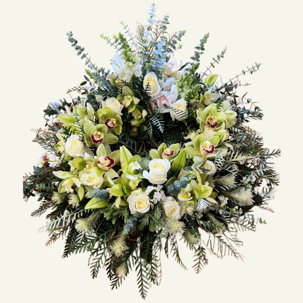 Tribute Wreath Whangārei with green orchids, white roses and seasonal foliage